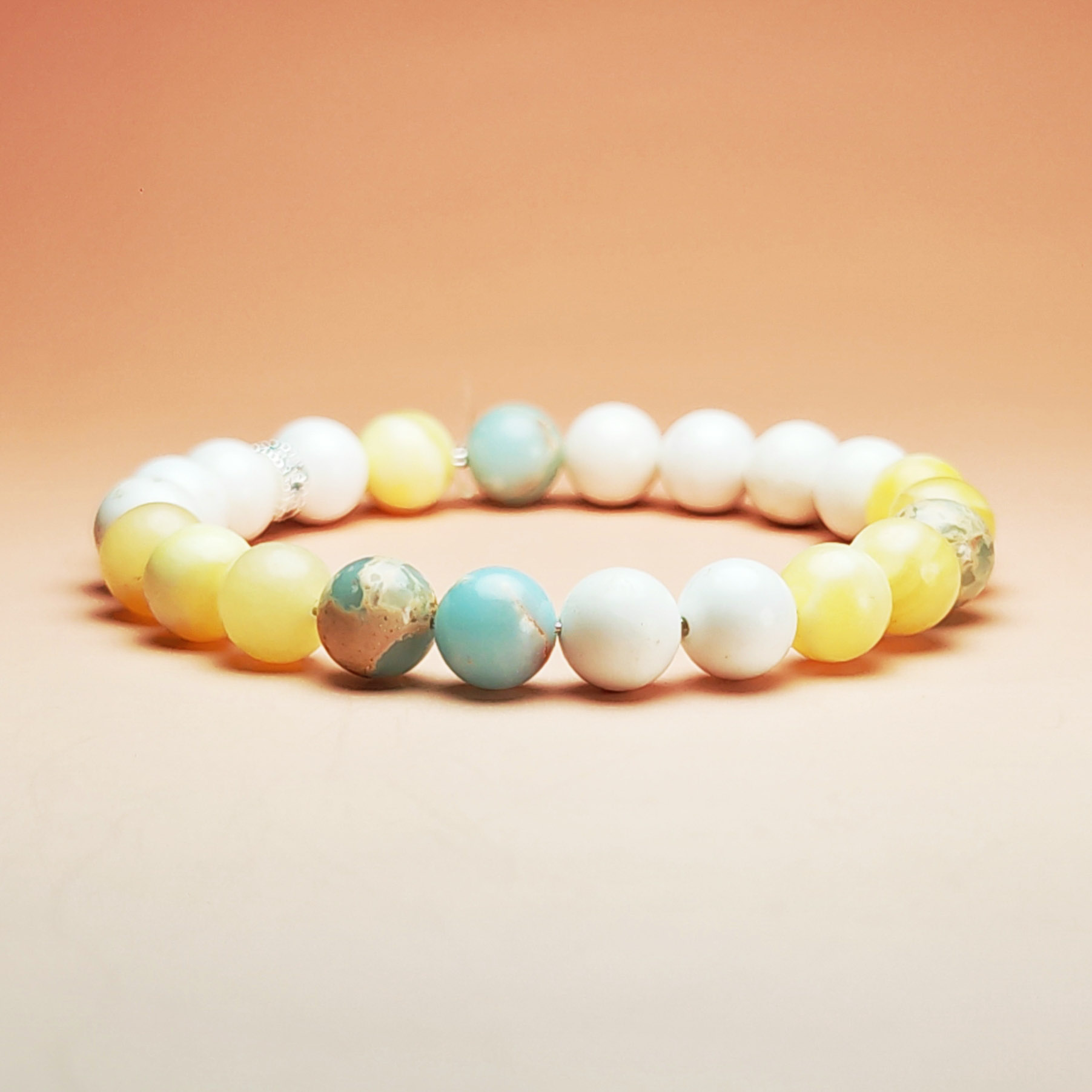 Aurum Meridian crystal bracelet with Shoushan Stone, Yellow Calcite, and White Magnesite for career stability and financial growth.