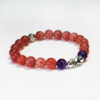 Handcrafted bracelet made with Strawberry Quartz and Amethyst representing the dreamy essence of the Fire Force.