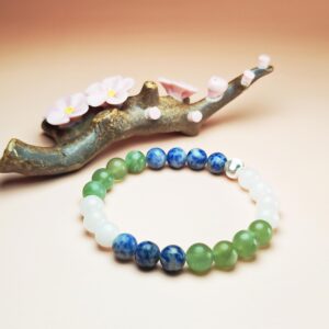 Celestia Current crystal bracelet with Xiuyan Jade, White Jade, and Dumortierite for good luck, health, and prosperity.