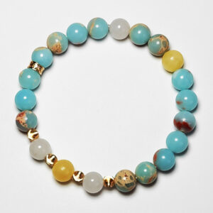 Astra Solum crystal bracelet with Shoushan Stone, White Jade, and Yellow Calcite for career success and good fortune.