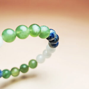 Celestia Current crystal bracelet with Xiuyan Jade, White Jade, and Dumortierite for good luck, health, and prosperity.