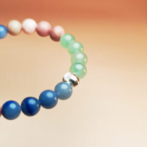 Celestia Arbor crystal bracelet with Blue Aventurine, Red Wood Grain, and Green Aventurine for health, charm, and good fortune.
