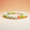 Aurora Threshold crystal bracelet with Green Grape Calcite, Orange Moonstone, and Yellow Calcite for new beginnings and lasting success.