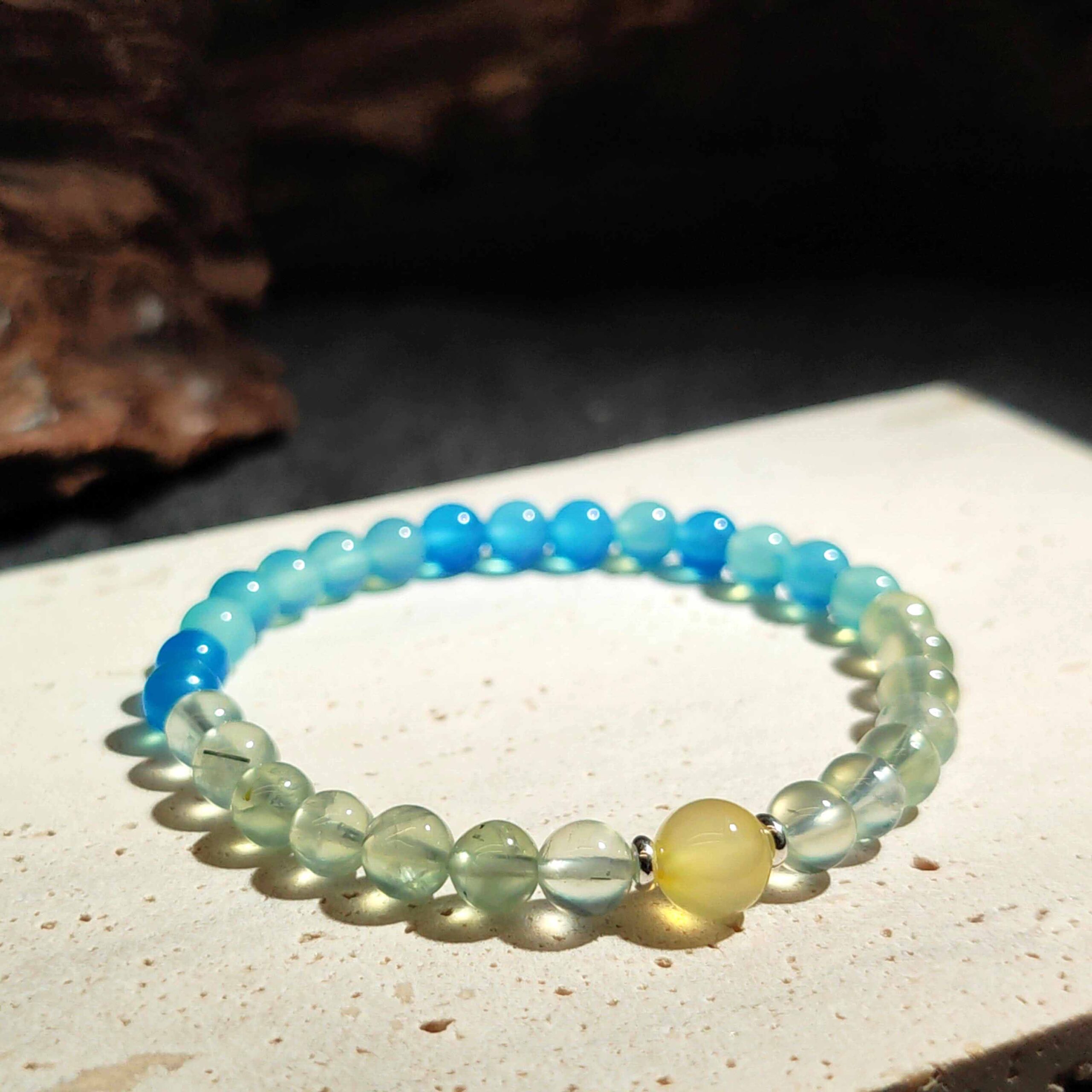 Still Bloom bracelet made with Prehnite, Yellow Agate, and Blue Agate for emotional balance and slow personal growth