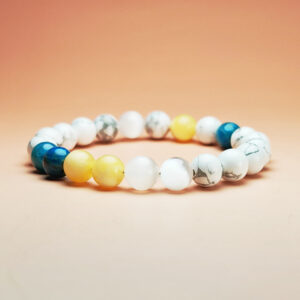 Aqua Aurea crystal bracelet with Yellow Calcite, White Selenite, White Turquoise, and Blue Apatite for stable and flowing wealth.