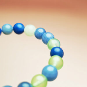 Harmonic Rise crystal bracelet with blue aventurine and grape agate for health, growth, and good fortune.