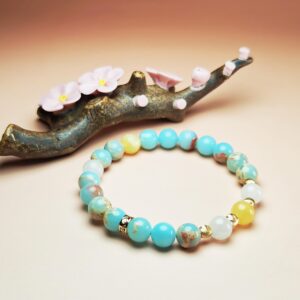 Astra Solum crystal bracelet with Shoushan Stone, White Jade, and Yellow Calcite for career success and good fortune.