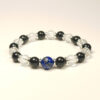 Clear Quartz, Obsidian, and Lapis Lazuli bracelet designed for protection, clarity, and visionary insight