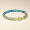 Still Bloom bracelet made with Prehnite, Yellow Agate, and Blue Agate for emotional balance and slow personal growth