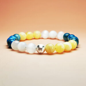 Fortuna Arc crystal bracelet with yellow calcite, blue apatite, and white selenite for wealth and prosperity.