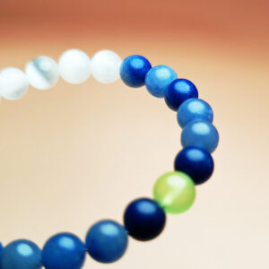 Aurora Turn crystal bracelet with white gypsum, blue aventurine, and grape agate for wealth, opportunity, and growth.