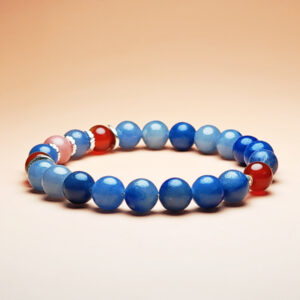 Fortuna Ember crystal bracelet with Red Agate, Red Wood Grain Jasper, and Blue Aventurine for love, fortune, and opportunity.