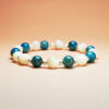 Lunaris Flux crystal bracelet with Shell Pearl and Blue Apatite for good luck and wisdom.