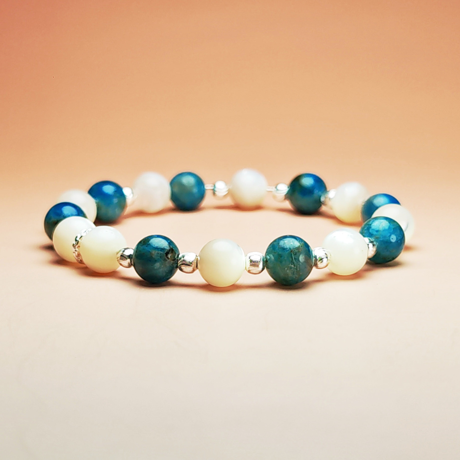 Lunaris Flux crystal bracelet with Shell Pearl and Blue Apatite for good luck and wisdom.
