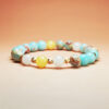 Astra Solum crystal bracelet with Shoushan Stone, White Jade, and Yellow Calcite for career success and good fortune.