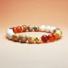Cindercrest crystal bracelet with red agate, crazy agate, and white howlite for wealth, career success, and protection.