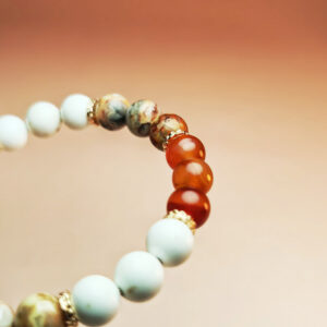 Cindercrest crystal bracelet with red agate, crazy agate, and white howlite for wealth, career success, and protection.