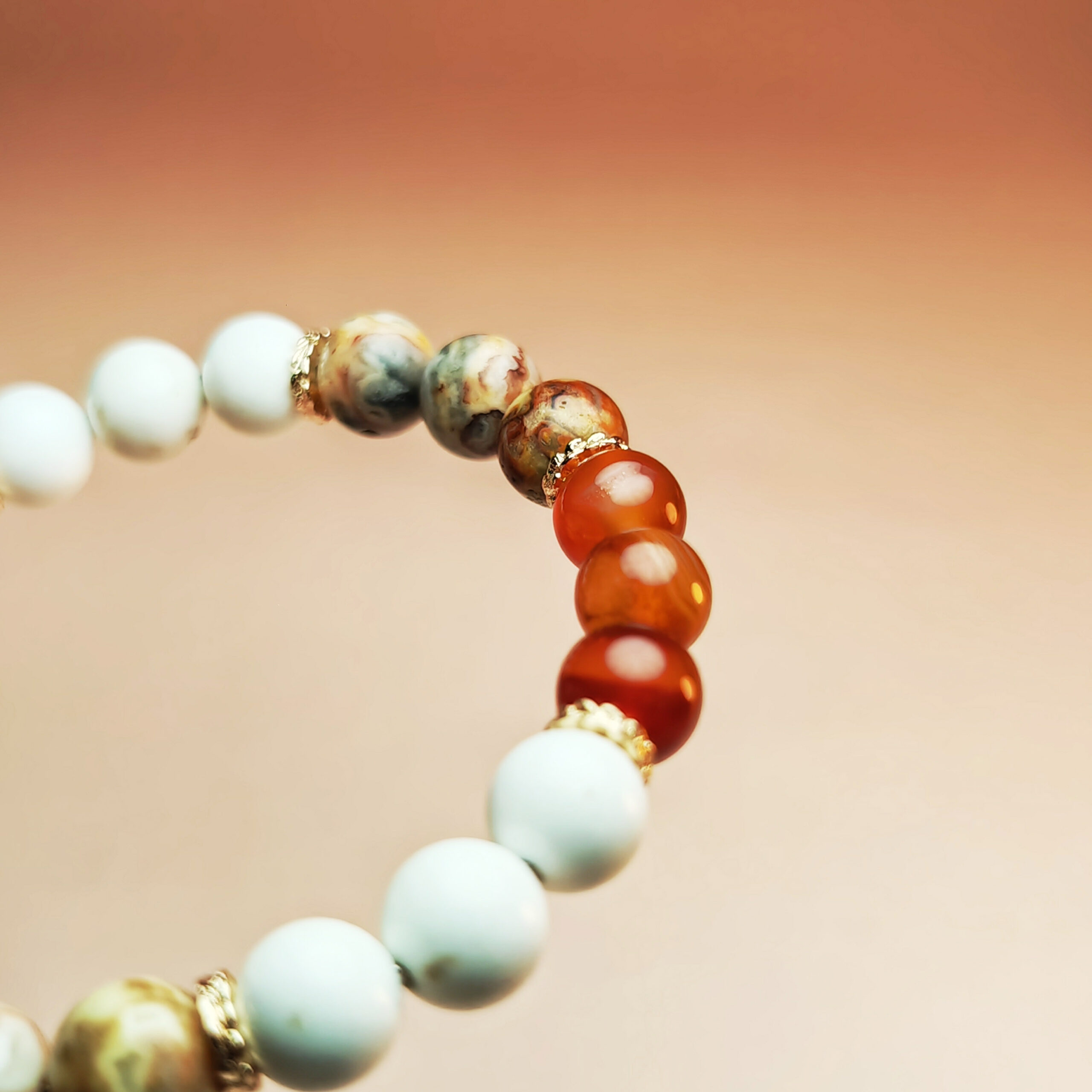 Cindercrest crystal bracelet with red agate, crazy agate, and white howlite for wealth, career success, and protection.