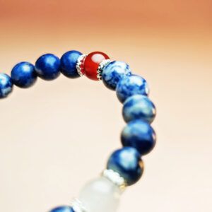 Fortune Tide five element crystal bracelet with dumortierite, grape chalcedony, red agate, white jade, and yellow calcite for protection, wealth, and love.