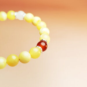 Celestial Ascent zodiac crystal bracelet with grape chalcedony, blue aventurine, blue-spot dumortierite, and red agate for Pisces, Cancer, Leo, and Sagittarius.