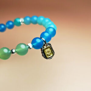 Tidebloom crystal bracelet with blue agate and grape agate for luck, renewal, and health.