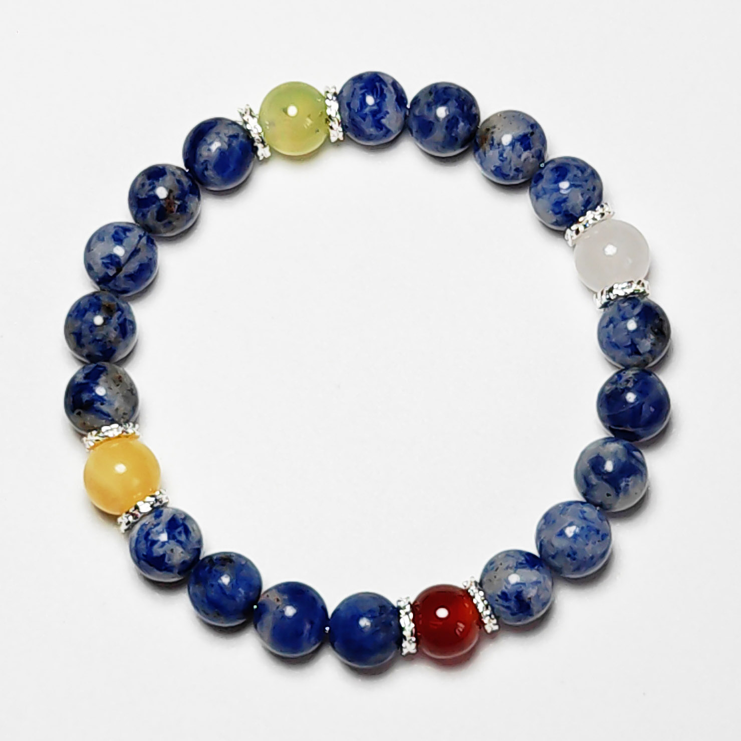 Fortune Tide five element crystal bracelet with dumortierite, grape chalcedony, red agate, white jade, and yellow calcite for protection, wealth, and love.
