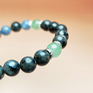 Tidal Turn zodiac crystal bracelet with black labradorite, blue aventurine, and green aventurine for Pisces, Cancer, and Sagittarius.