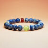 Fortune Tide five element crystal bracelet with dumortierite, grape chalcedony, red agate, white jade, and yellow calcite for protection, wealth, and love.