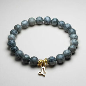 Capra Nexus picasso jasper zodiac bracelet with Capricorn pendant for ambition and grounding.