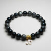 Noctis Veil silver obsidian zodiac bracelet with Scorpio pendant for protection and transformation.
