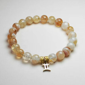 Gemini Lumen yellow topaz zodiac bracelet with Gemini pendant for clarity, prosperity, and communication.