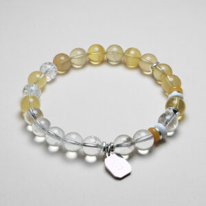 Scorpio Auric zodiac bracelet with yellow fluorite, clear quartz, white turquoise, and topaz for empowerment and prosperity.