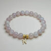 Pisces Serenade rose quartz zodiac bracelet with Pisces pendant for love, intuition, and harmony.
