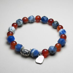 Taurus Ignis zodiac bracelet with red agate, sodalite, and Taurus pendant for strength and prosperity