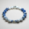 Gemini Aether zodiac bracelet with sodalite, white turquoise, and engraved pearl for clarity and balance.